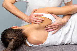 Chiropractic treatment on the top of the back.